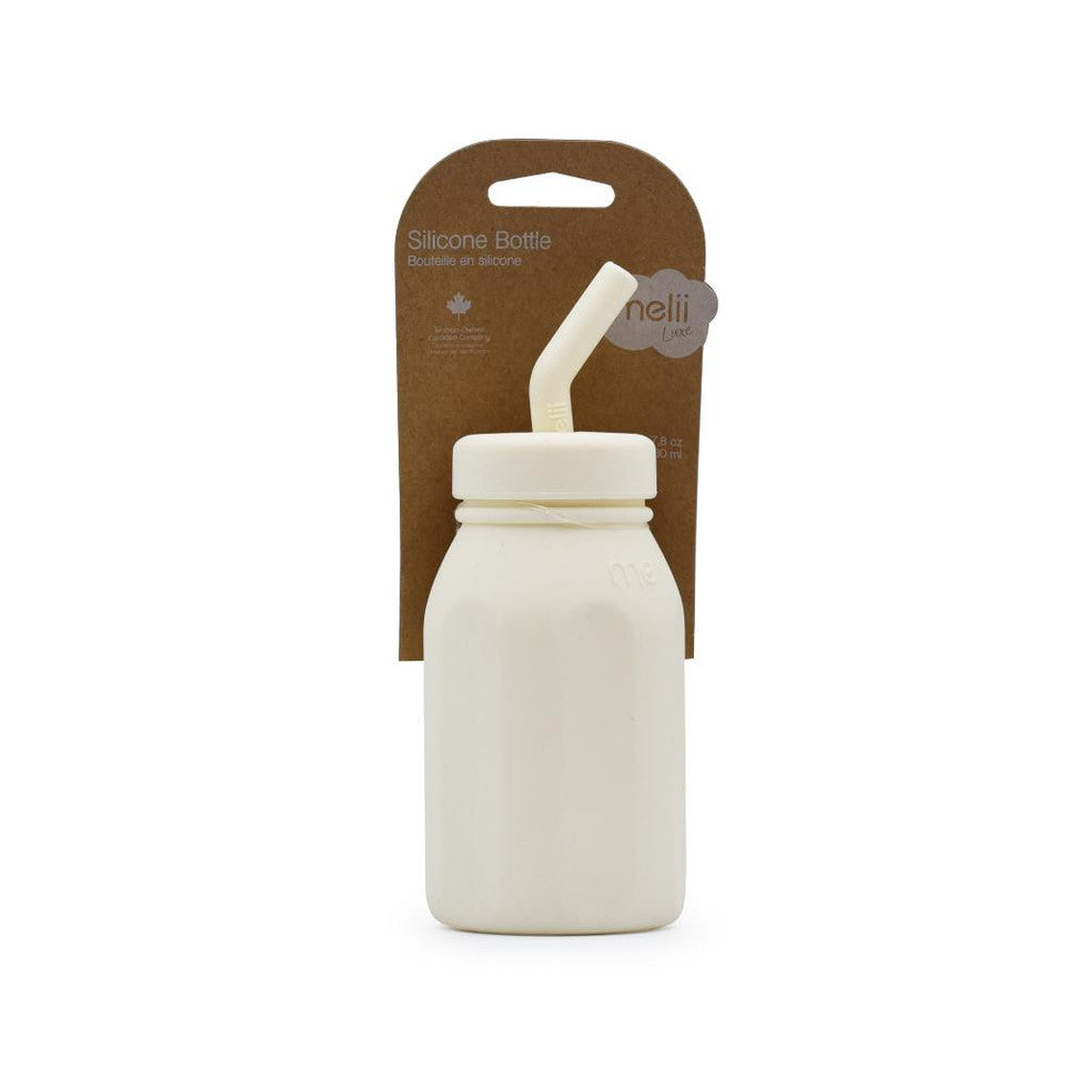 Silicone bottle with straw and packaging on a white background