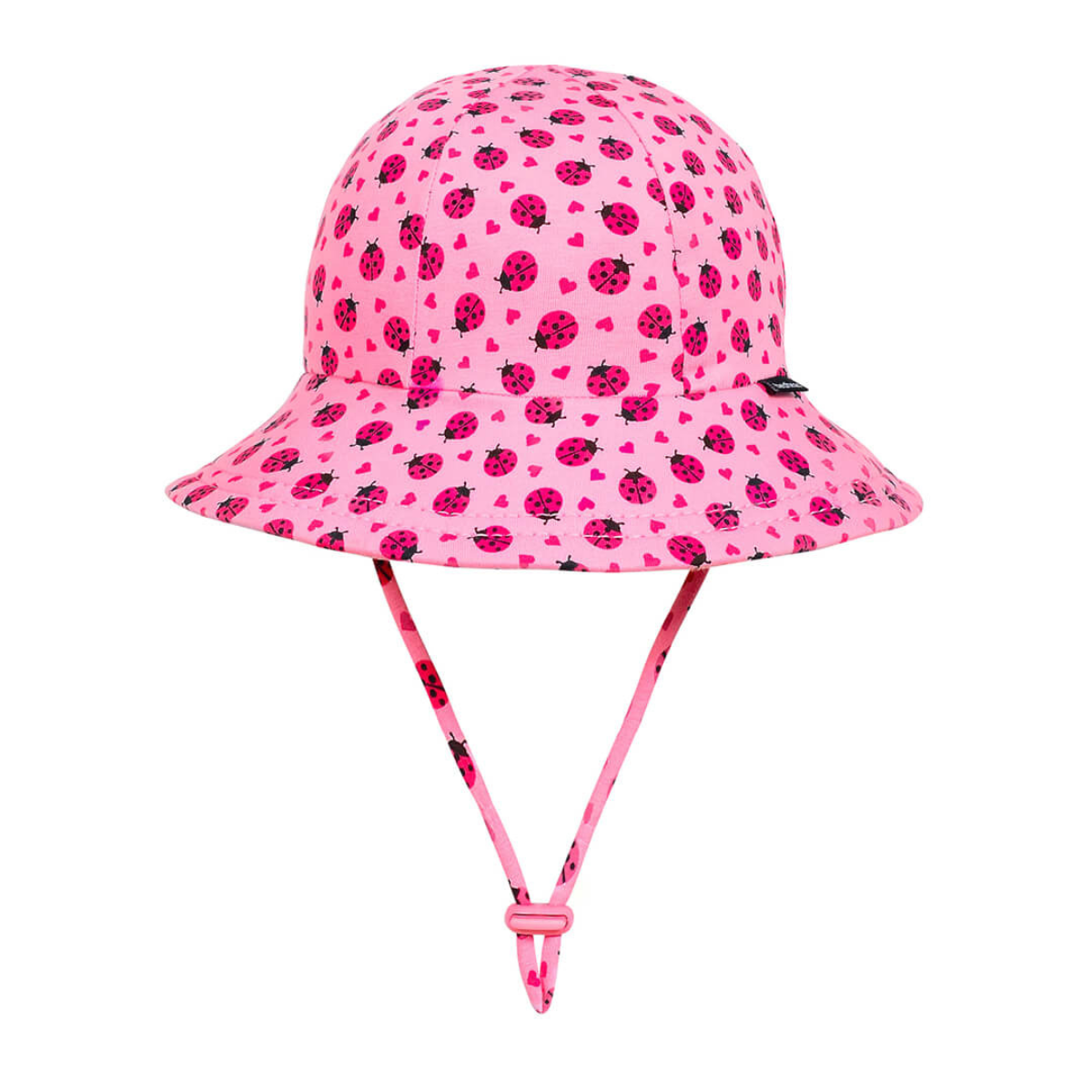 Pink bucket hat with ladybug pattern on a white background