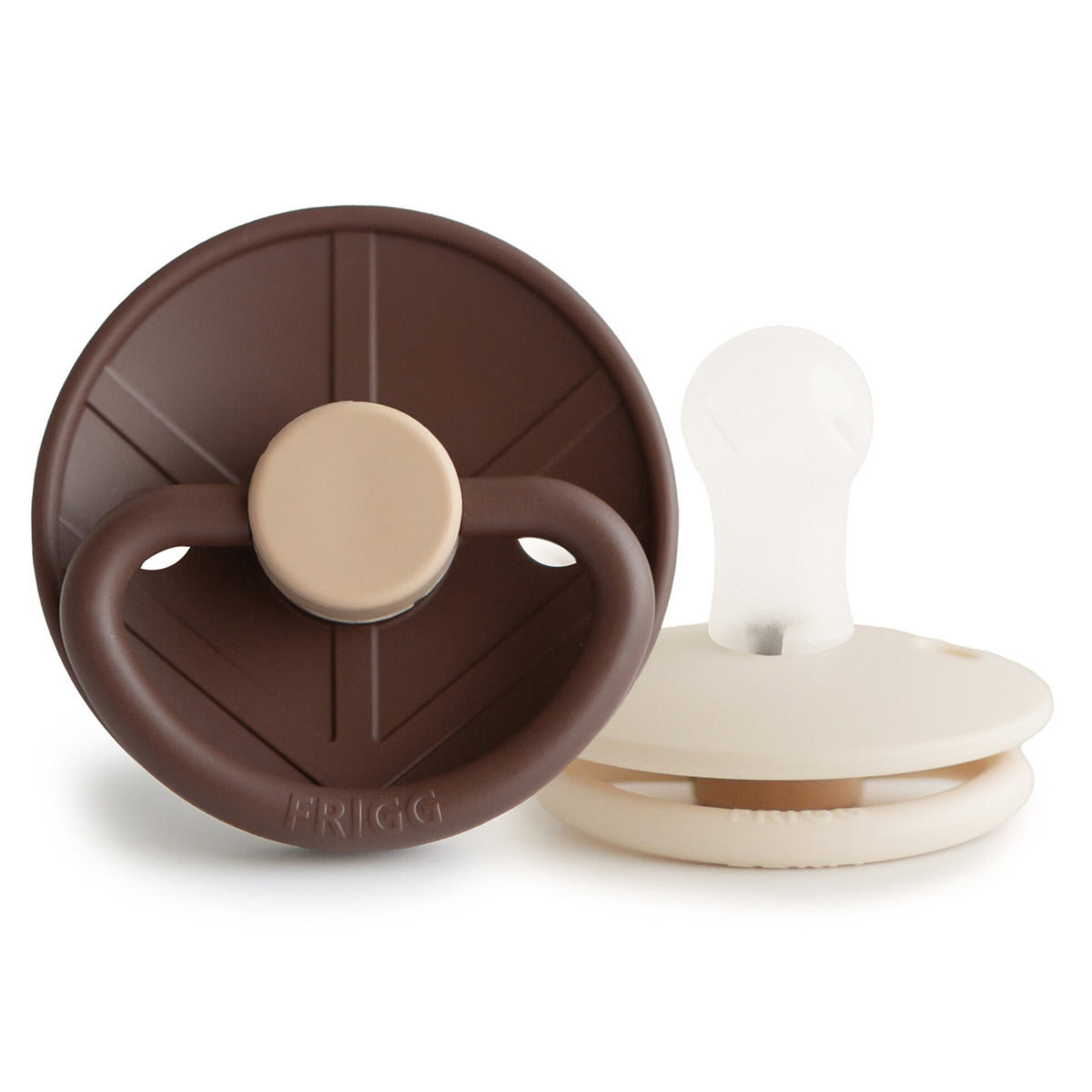 Two baby pacifiers, one brown and one white, on a white background.