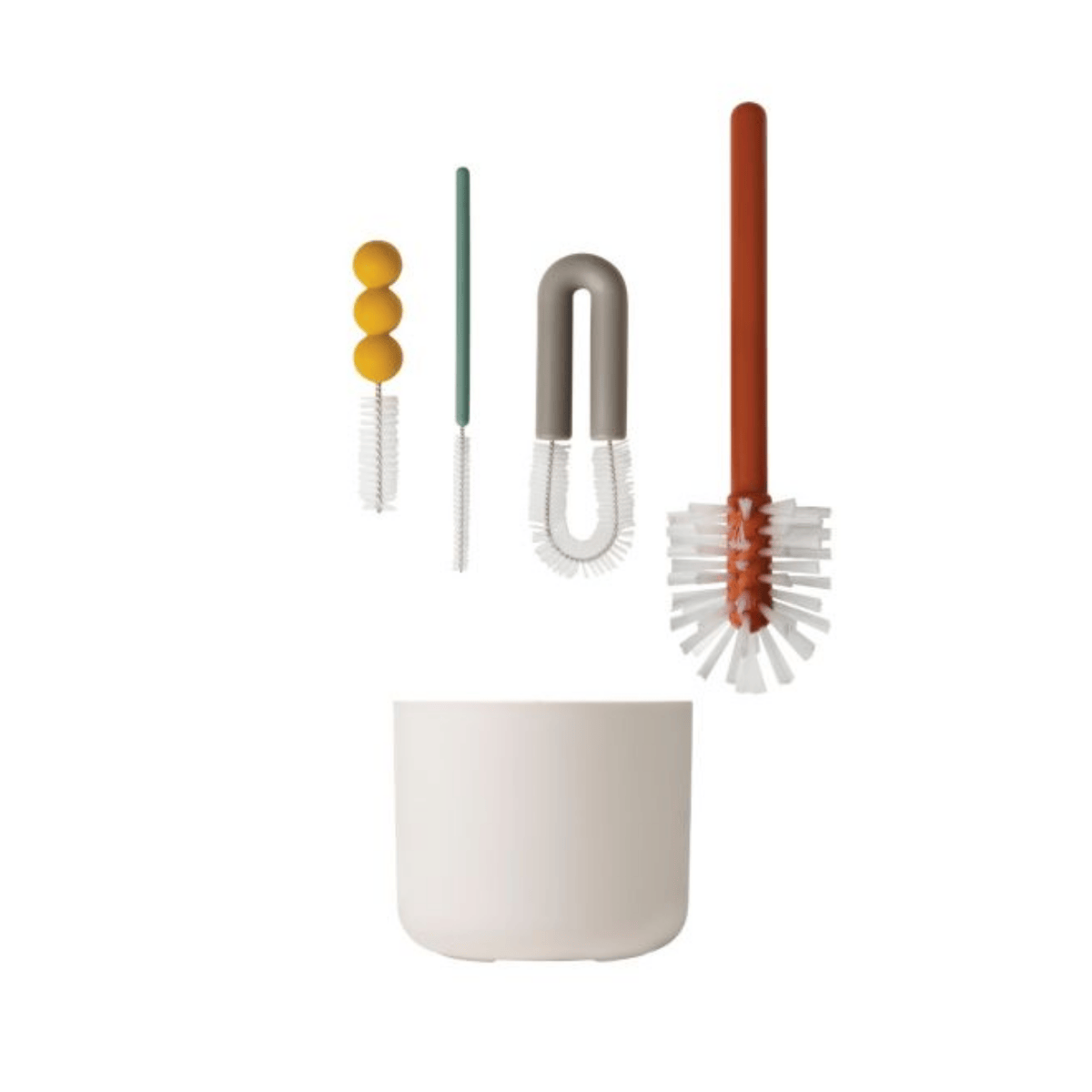 Set of cleaning brushes with a white container on a white background