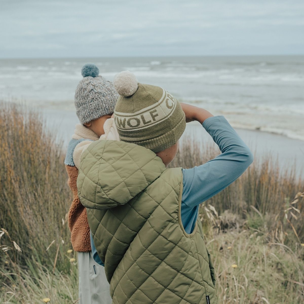 Two Boys outside wearing the Alpine fern and the blue speckled beanie by Crywolf.