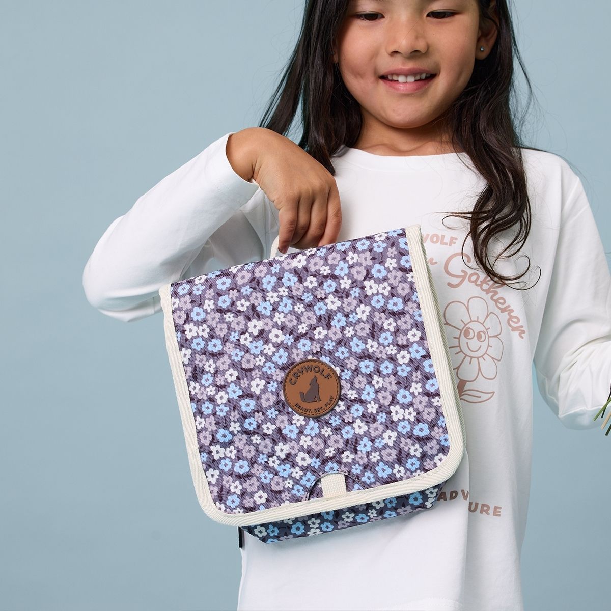 A girl with her Crywolf Hanging Toiletry Bag.