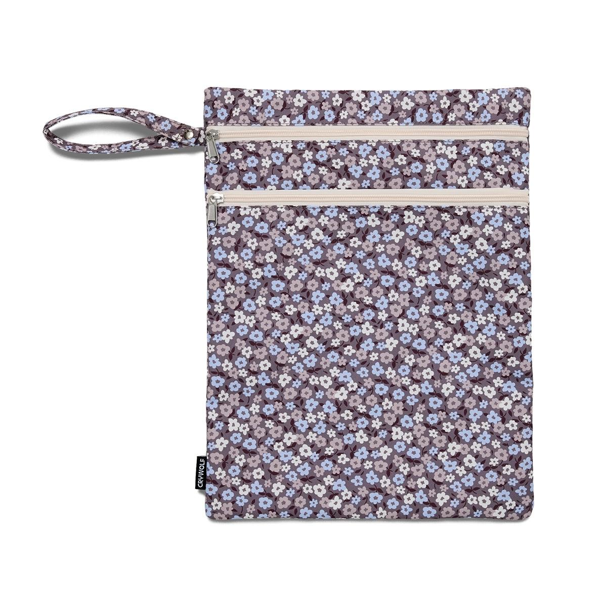 Eco-friendly Crywolf Wet Bag made from recycled materials, featuring a water-resistant exterior and waterproof-coated interior. Dual zip compartments provide wet and dry storage, with a convenient carry wrist strap. Flower Fields pattern.