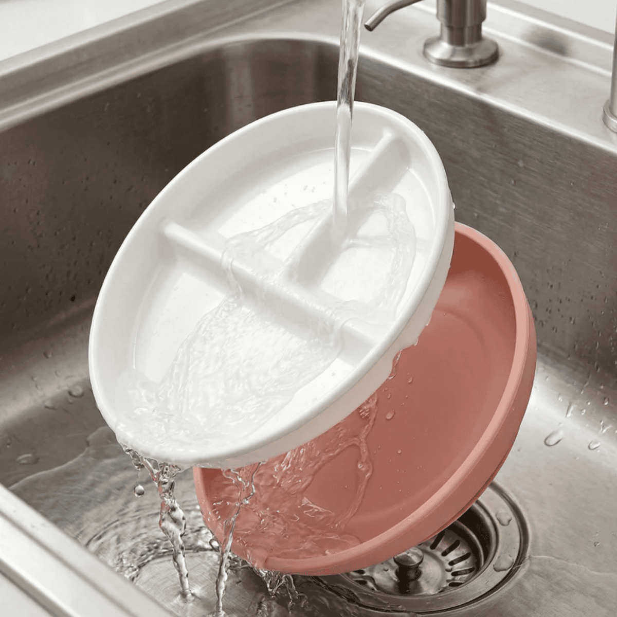 Ceramic divided plate with suction bottom  being washed 