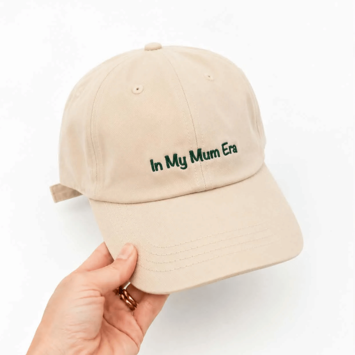 Cotton baseball cap in beige with the words 'in my mum era' on it. 