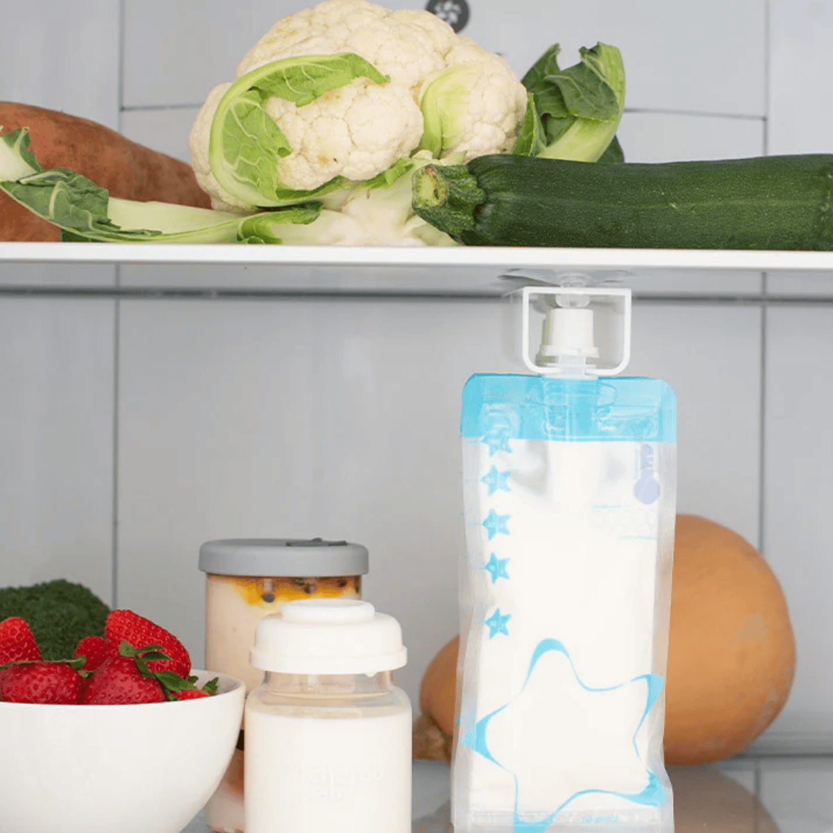 Reusable milk bags with vegetables and fruits in the background