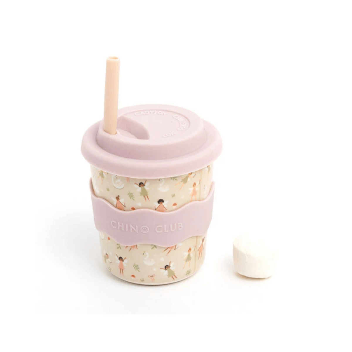 A reusable tumbler cup with a light pink lid and straw, a pale pink silicone sleeve printed with small ballerina figures, and a floral-patterned body. A small white cap sits beside it on a clean white background.