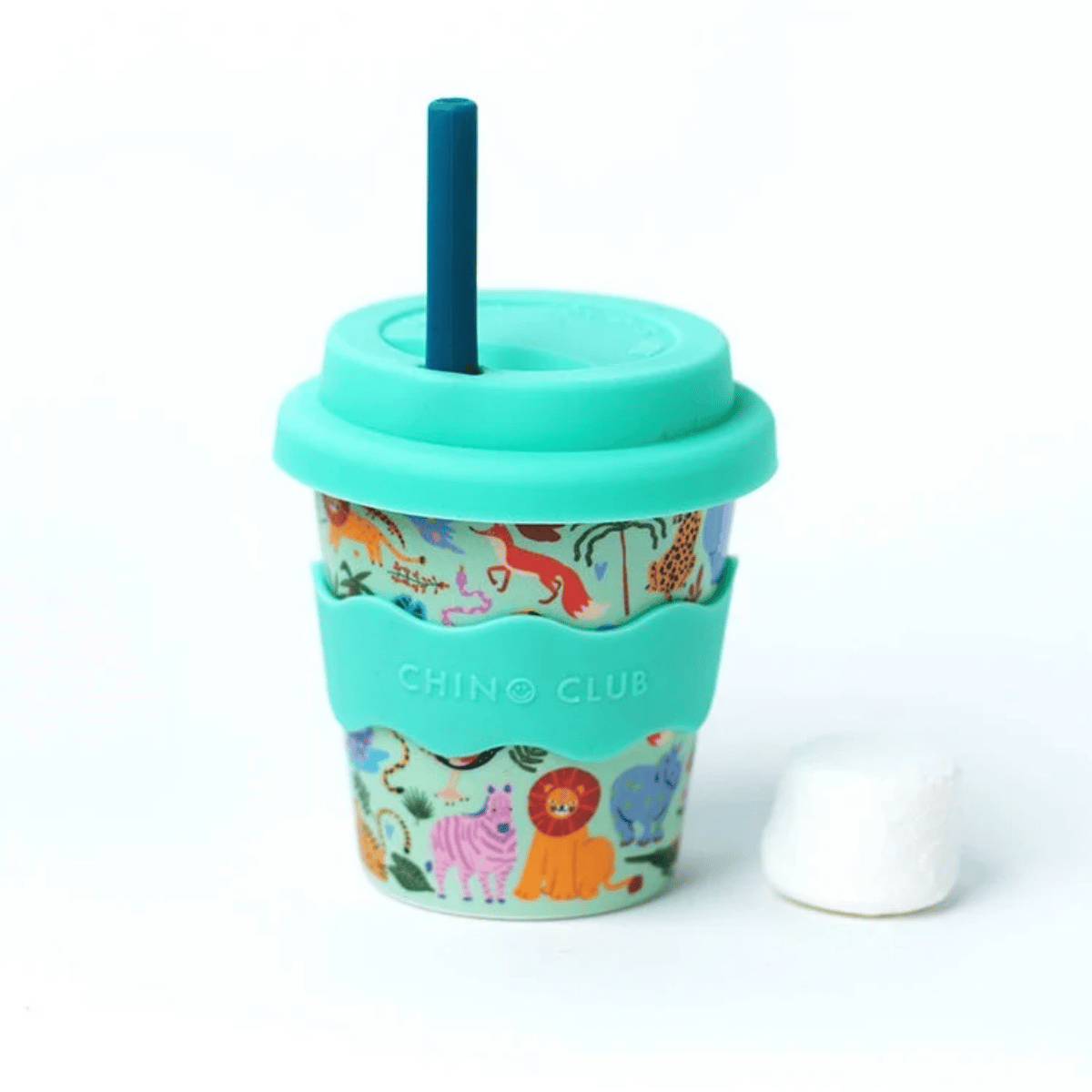 A reusable travel tumbler cup with a turquoise lid and straw, featuring a colorful animal print and a turquoise silicone sleeve with the brand name 'CHINO CLUB'. A small white marshmallow is placed next to it on a clean white background.