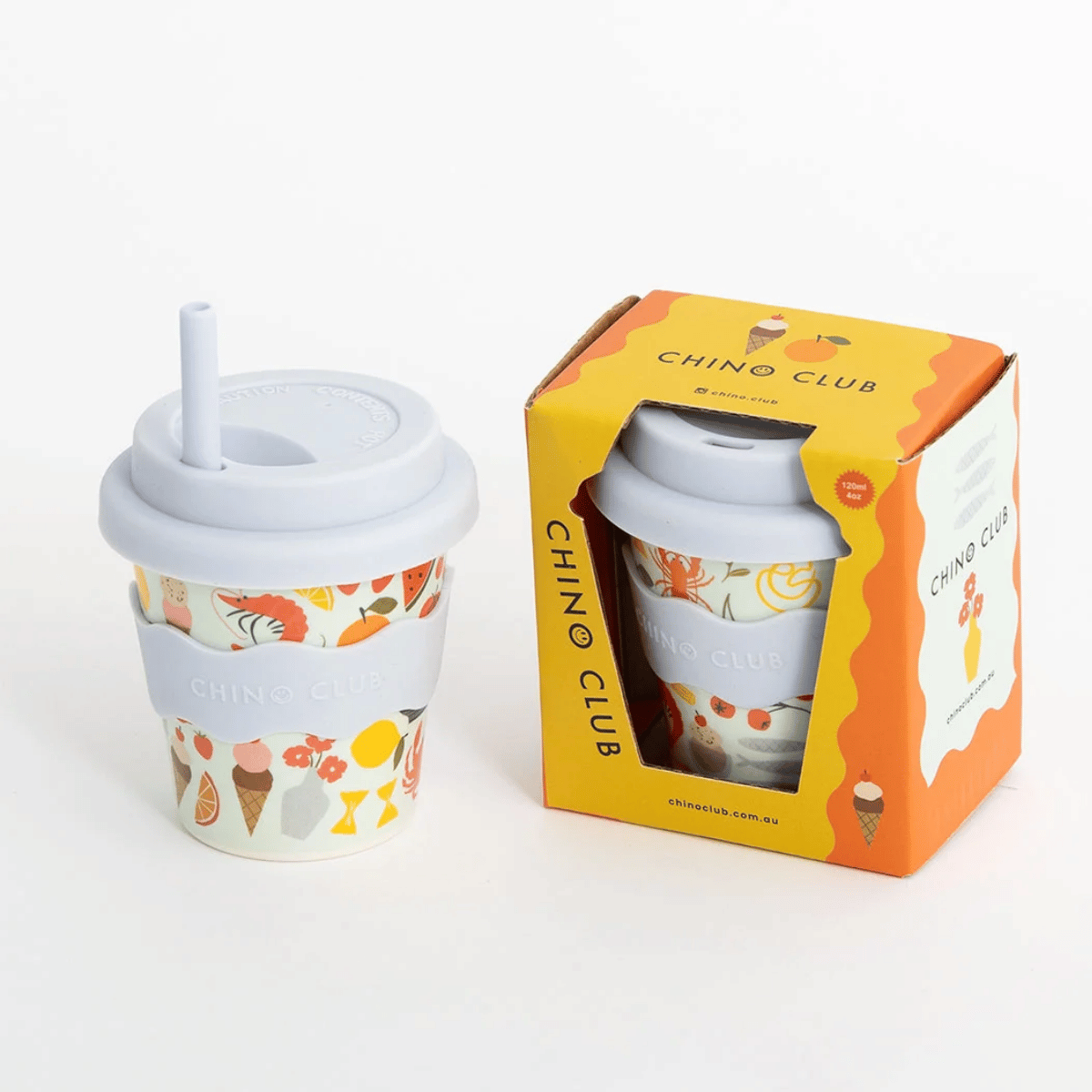 A reusable fluffy cup with a light gray lid and straw, featuring a colorful ice cream cone pattern, shown next to its orange and yellow Chino Club retail box on a clean white background.