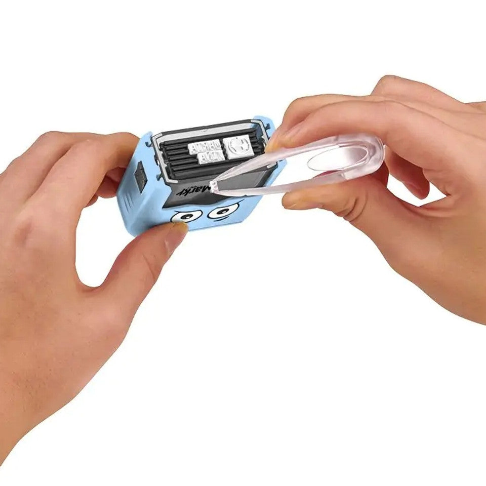 Person using a small blue device with a roll of tape on a white background