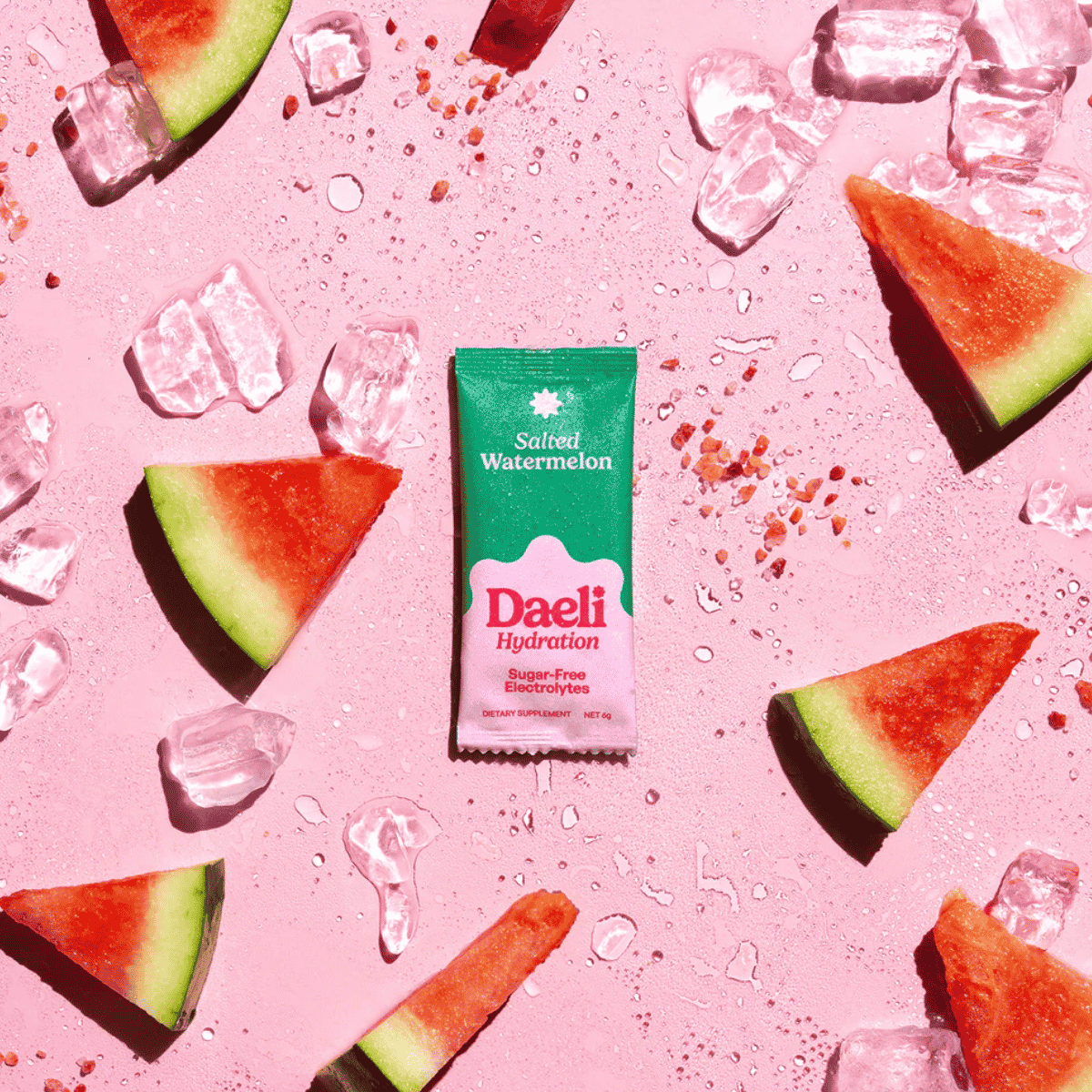Daeli hydration package with watermelon slices and ice cubes on a pink background