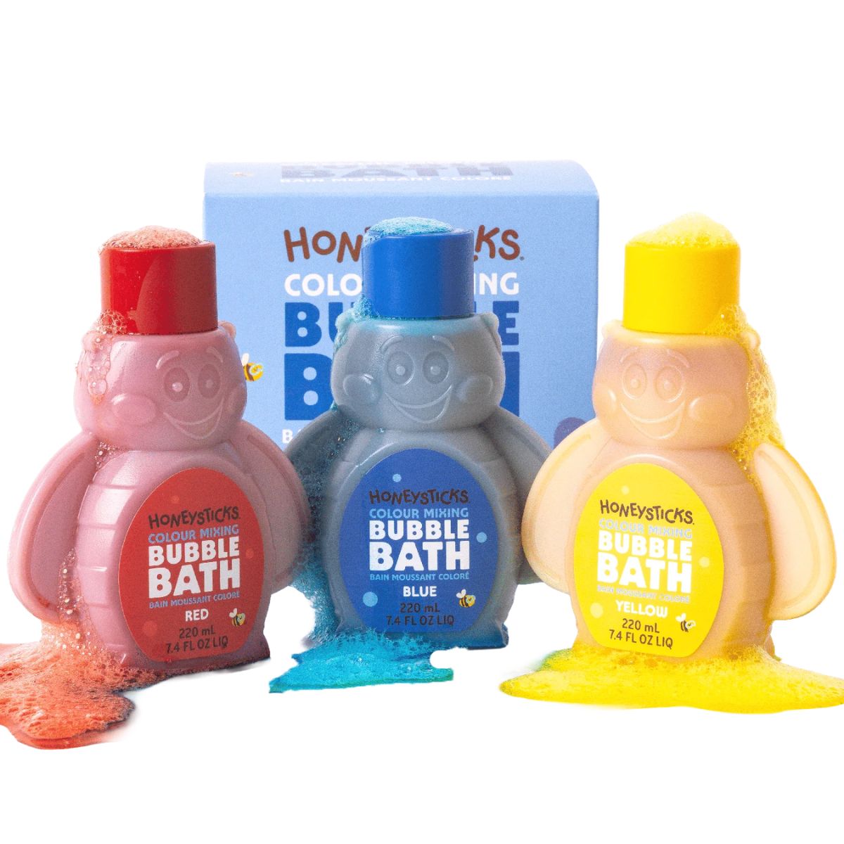 Three bottles of Honeysticks bubble bath in red, blue, and yellow with a box in the background.