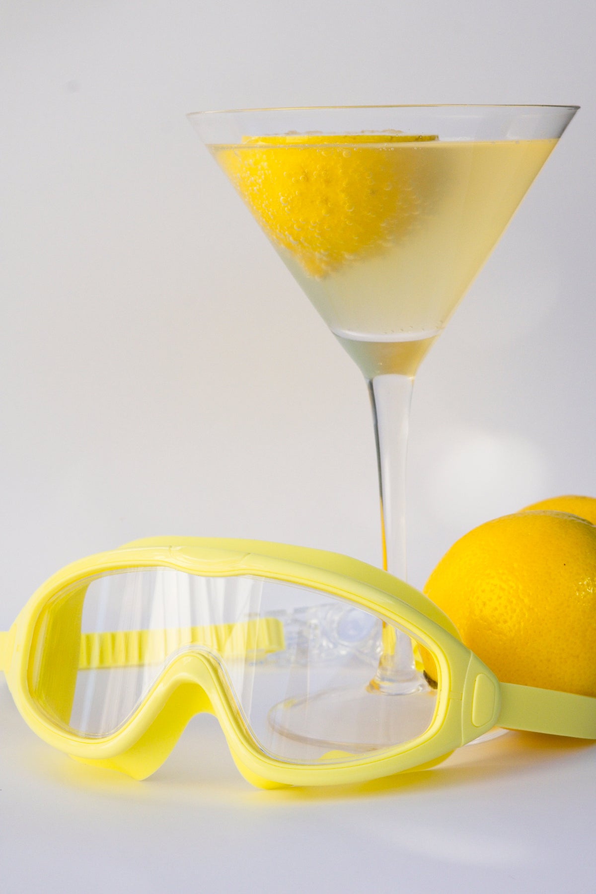Yellow goggles on a light gray background
