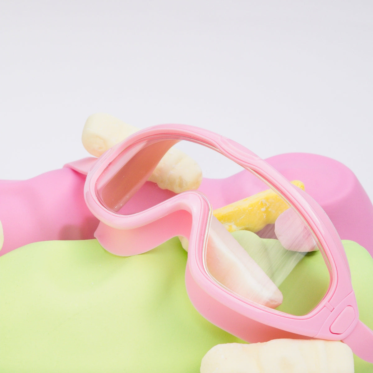 Pink goggles with a colorful background