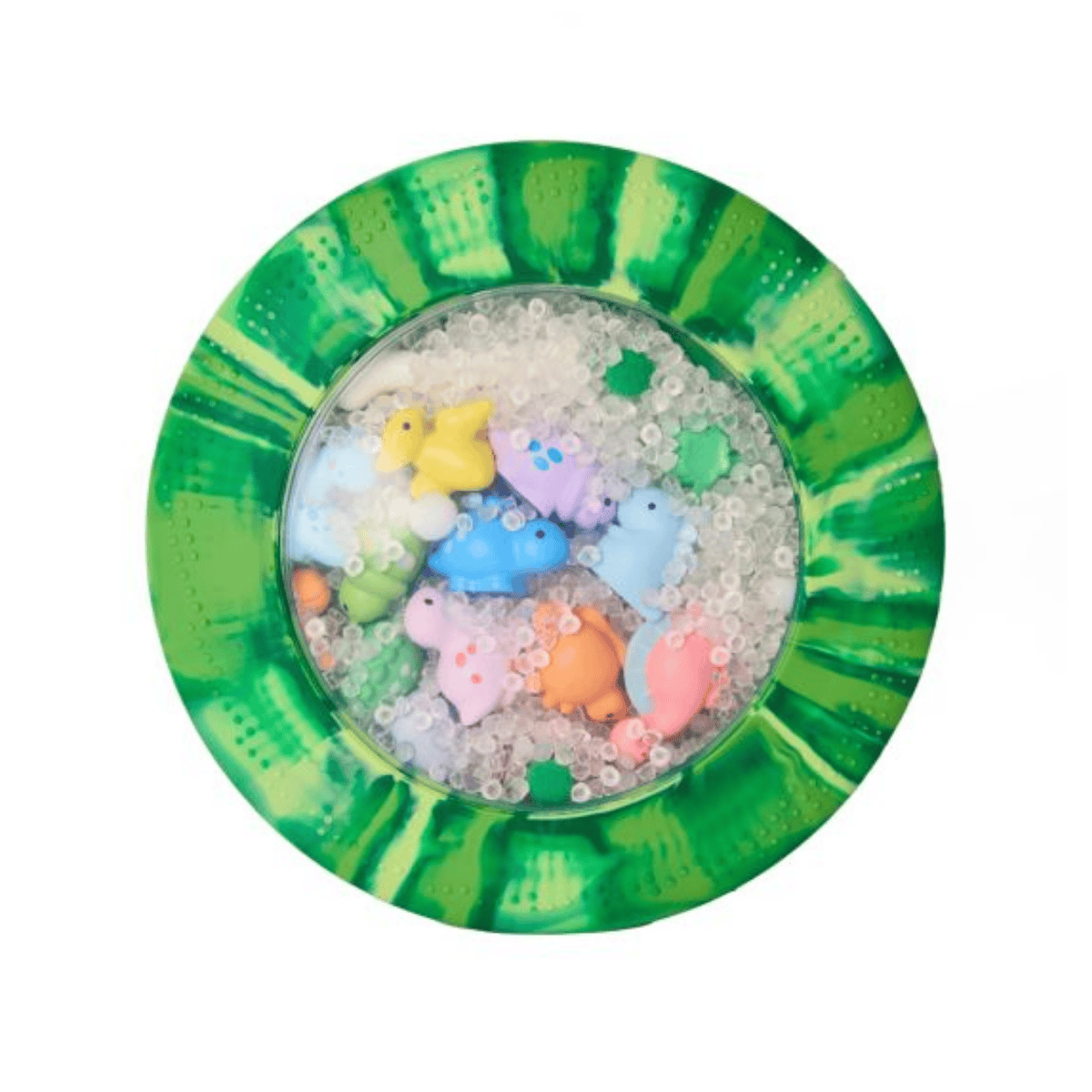 Colorful rubber duck toys in a green and white sensory mat  with water beads on a white background