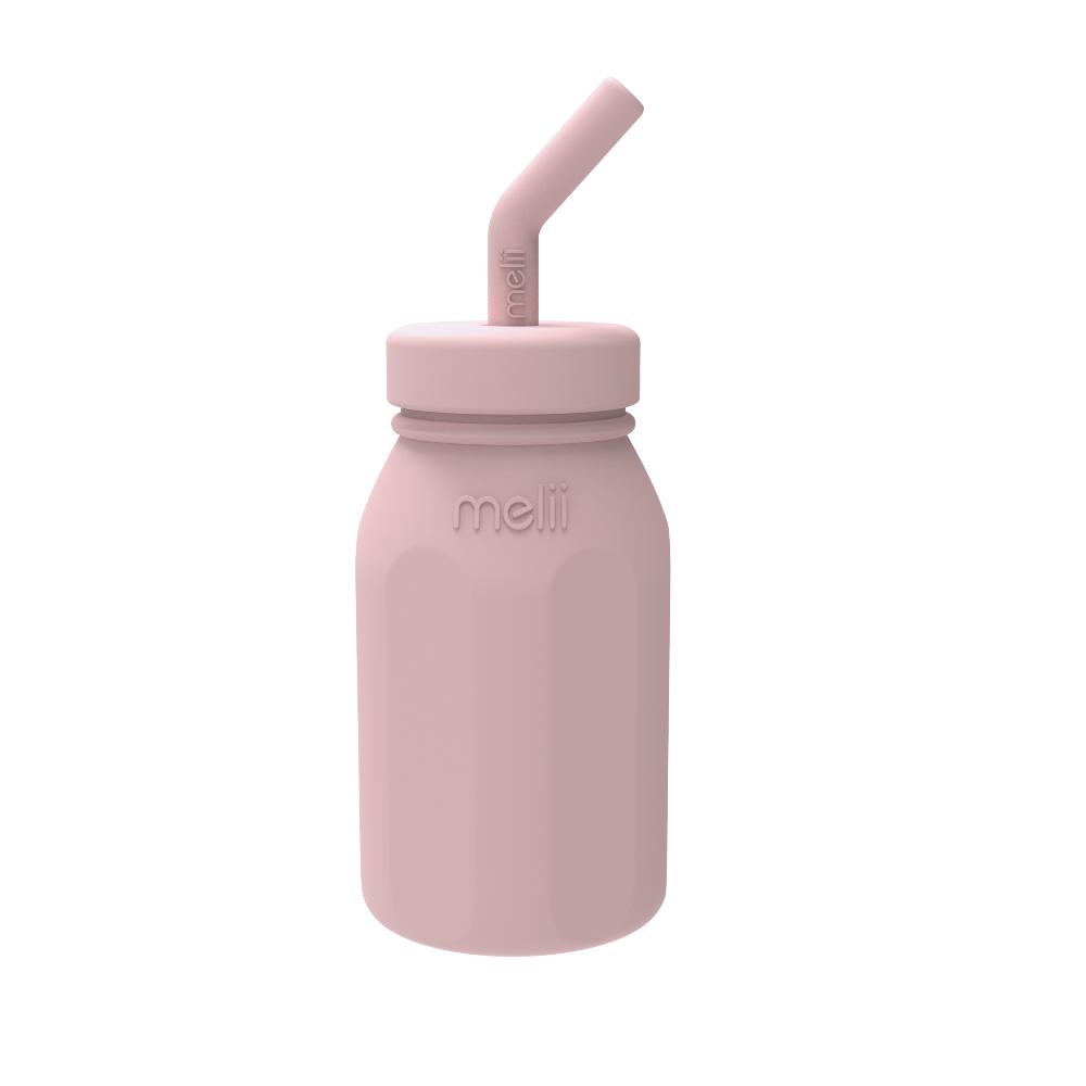 Pink water bottle with straw lid on a white background