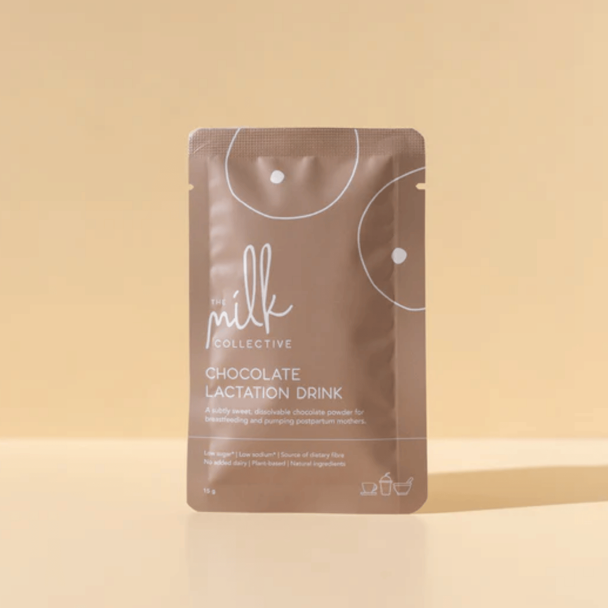 Chocolate lactation drink package from The Milk Collective on a beige background