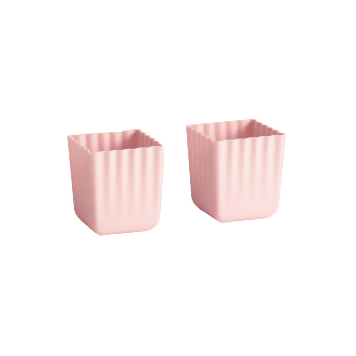 Two small pink square containers with a fluted or ribbed edge, shown on a plain white background.