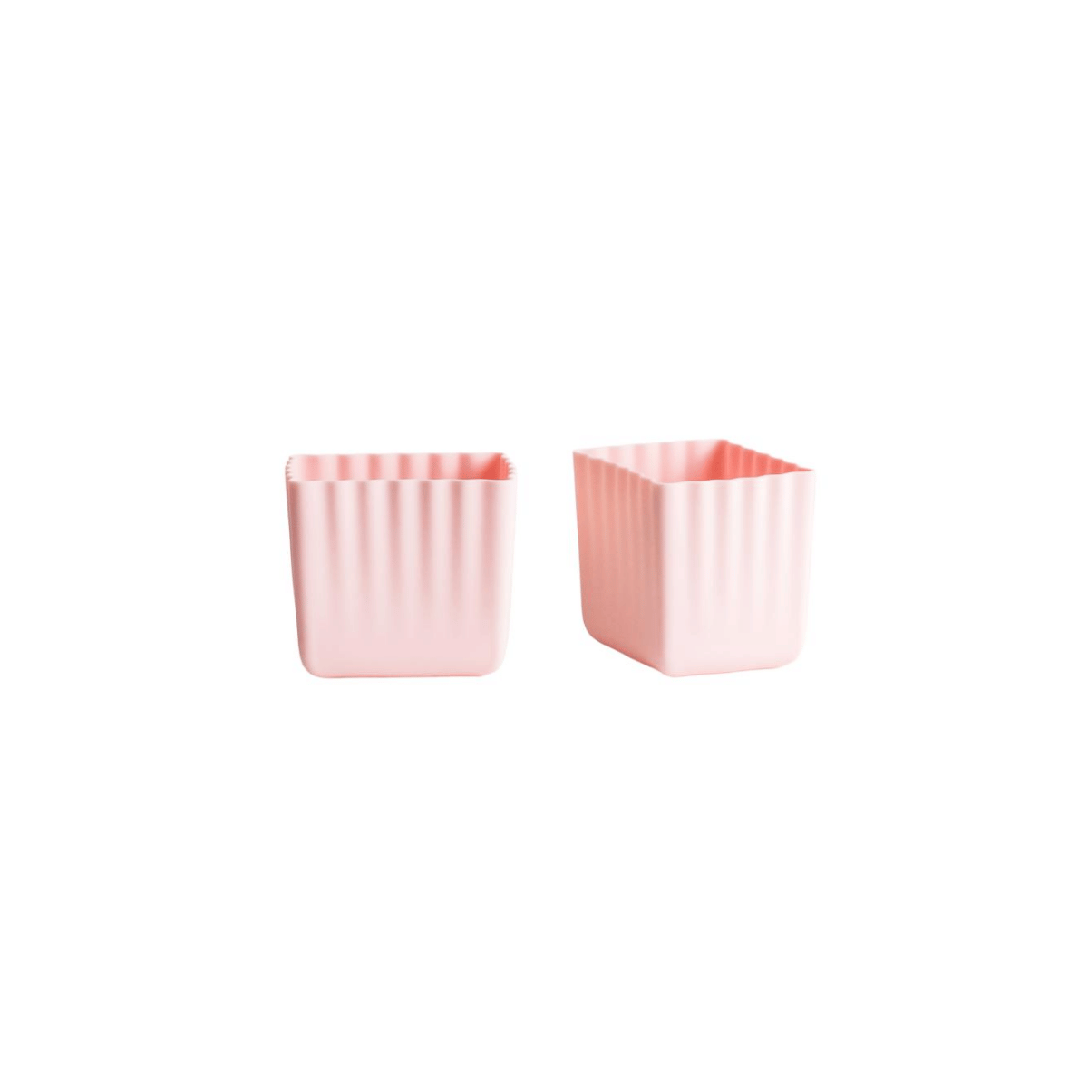 Two small square pink containers with vertical fluted sides, shown on a plain white background.