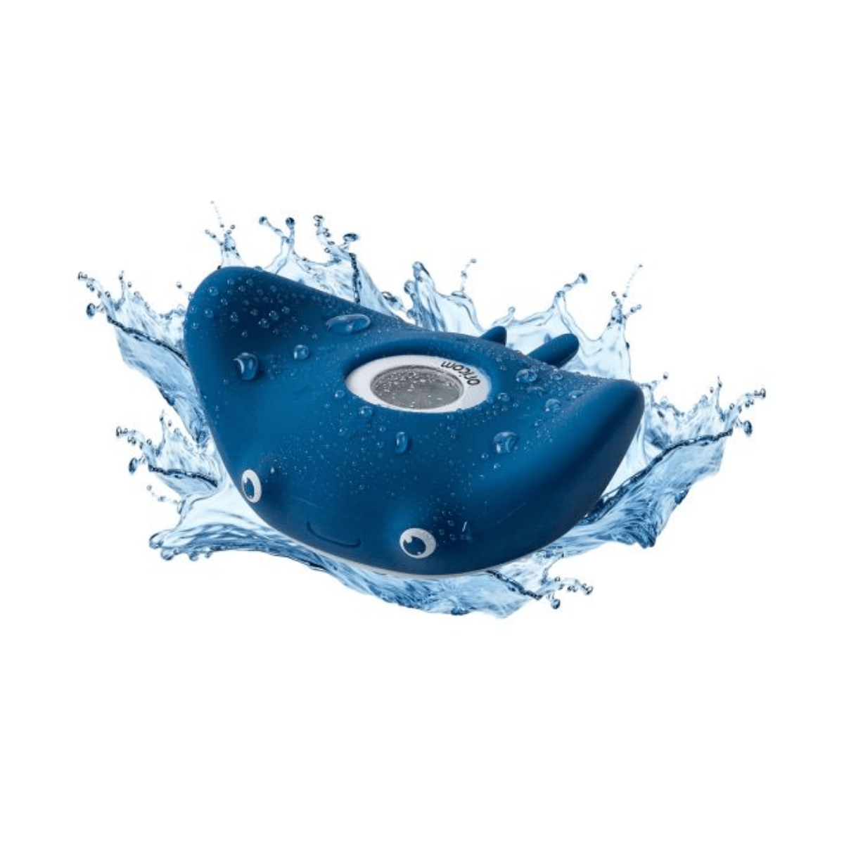 Blue whale-shaped toy with water splashes on a white background