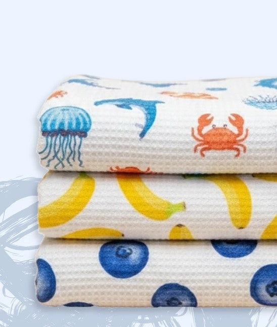 Stack of three fabric swatches with colorful patterns on a white background