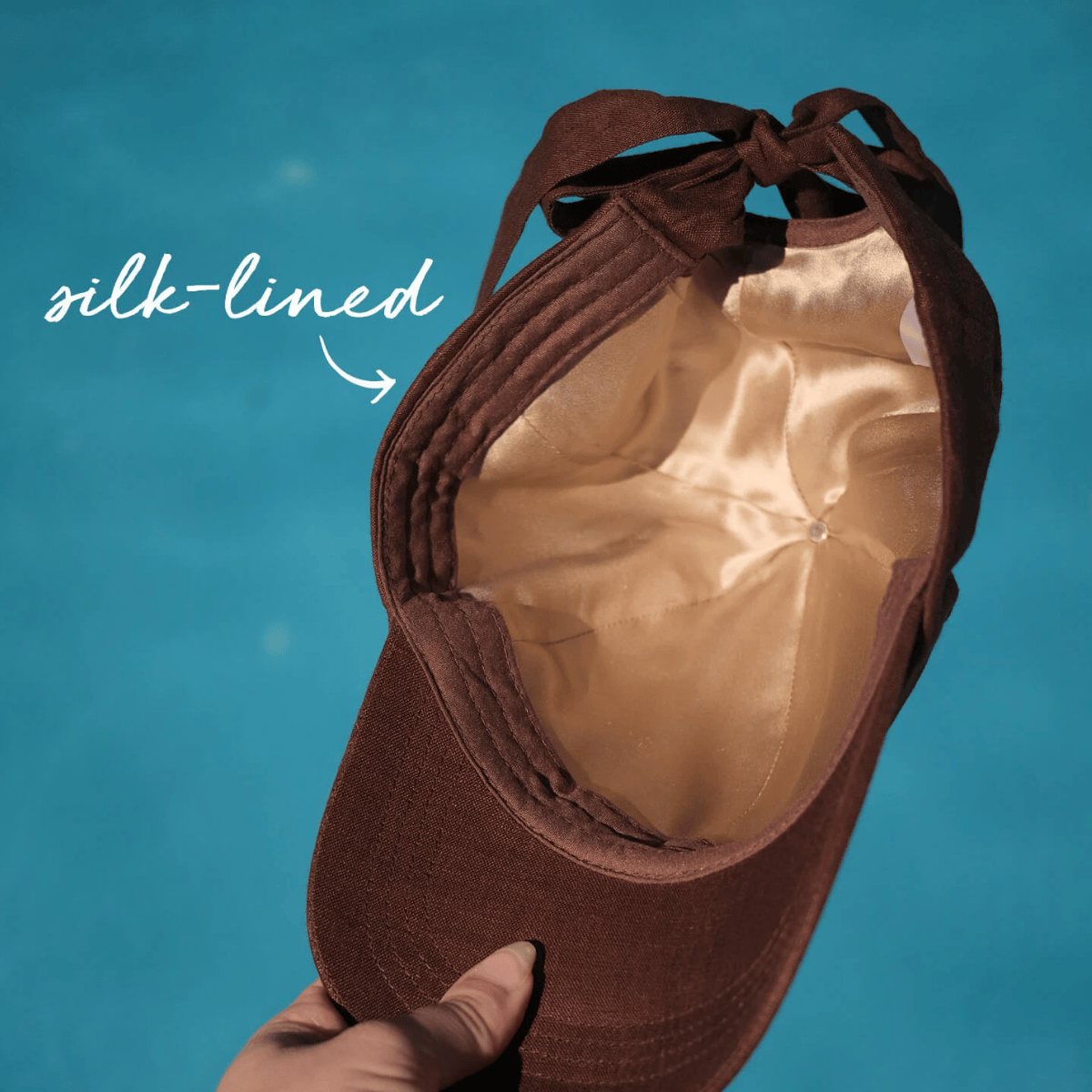 Brown ballet shoe with silk-lined interior on a blue background
