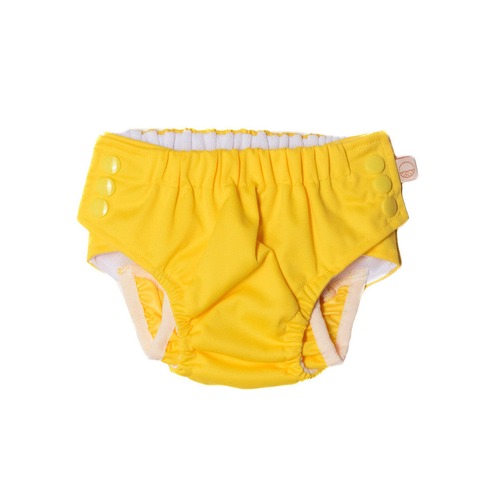 Yellow baby diaper with white trim on a white background