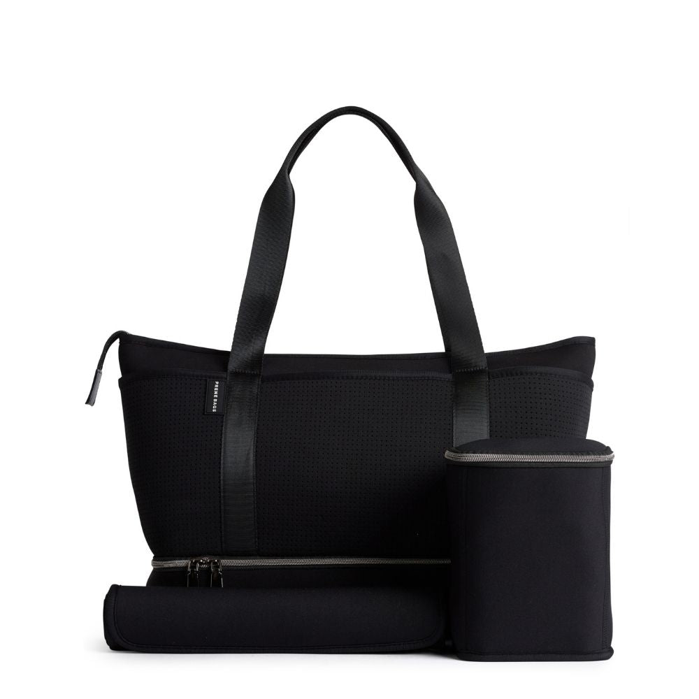 This Prene Sunday Bag is a versatile, vegan-friendly diaper bag with 14 pockets, a matching mini bag, changing mat, and a separate bottom compartment.