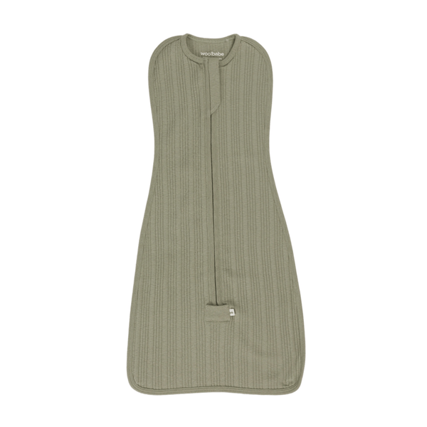 Green baby sleeping bag swaddle with a visible brand label on a white background