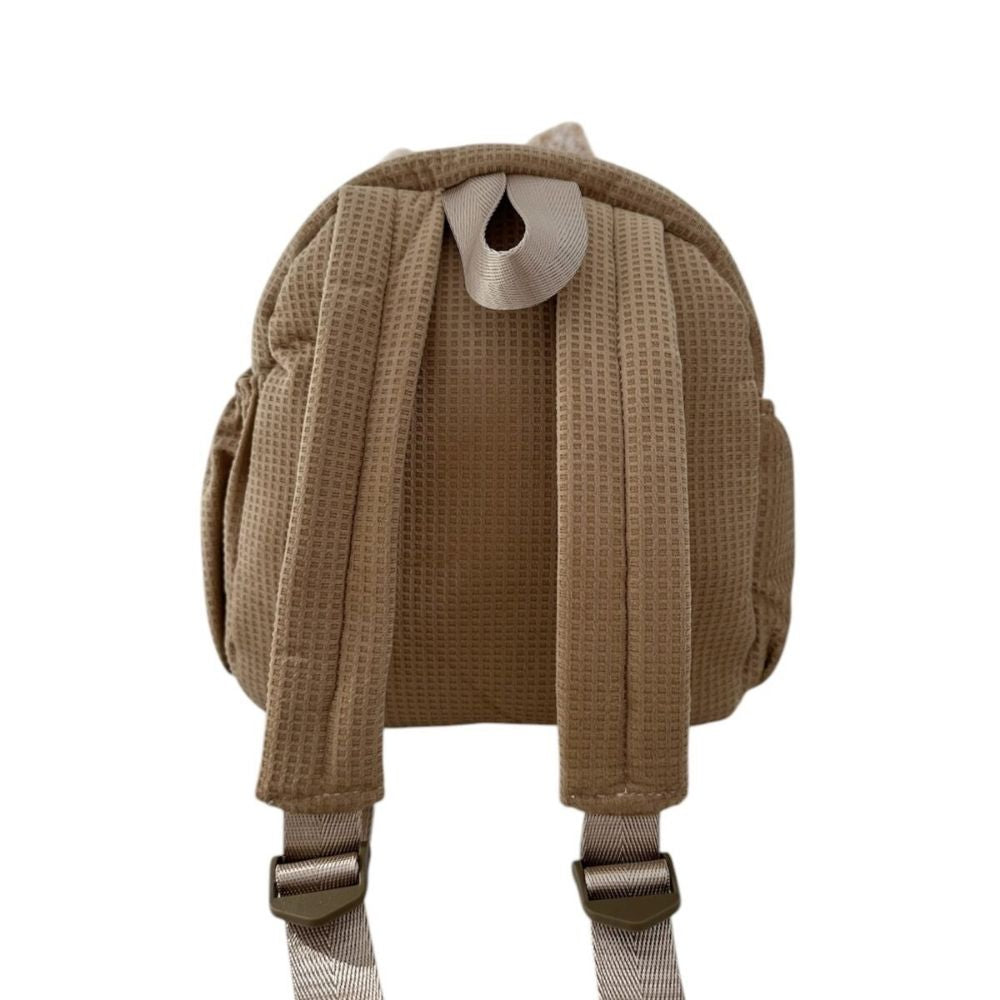 The back of the brown fox backpack. durable straps and comfy for children.