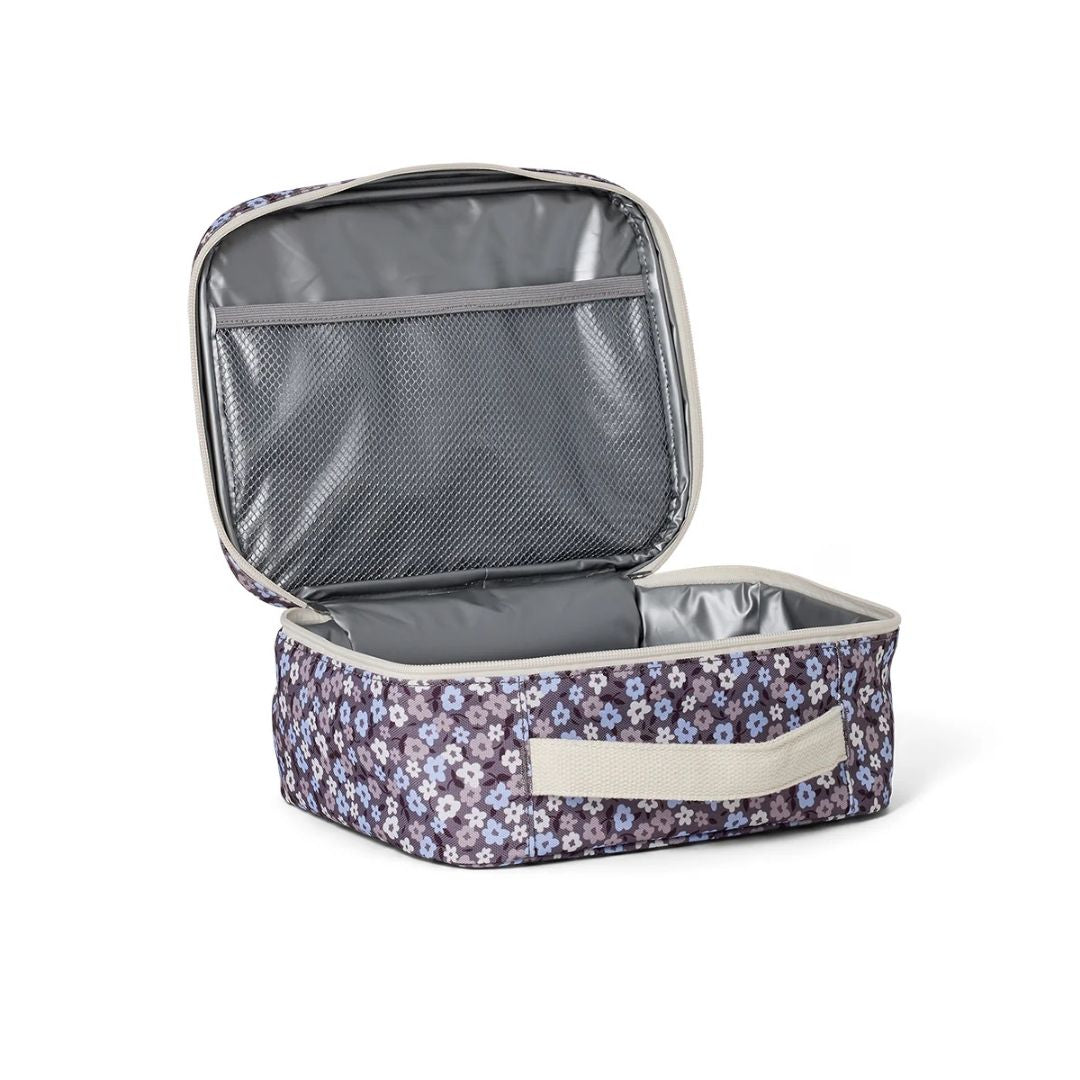 Inside view of the Floral Fields Crywolf Everyday Lunch Bag, showing the insulated lining, mesh pocket for organization, and easy-to-clean interior design.