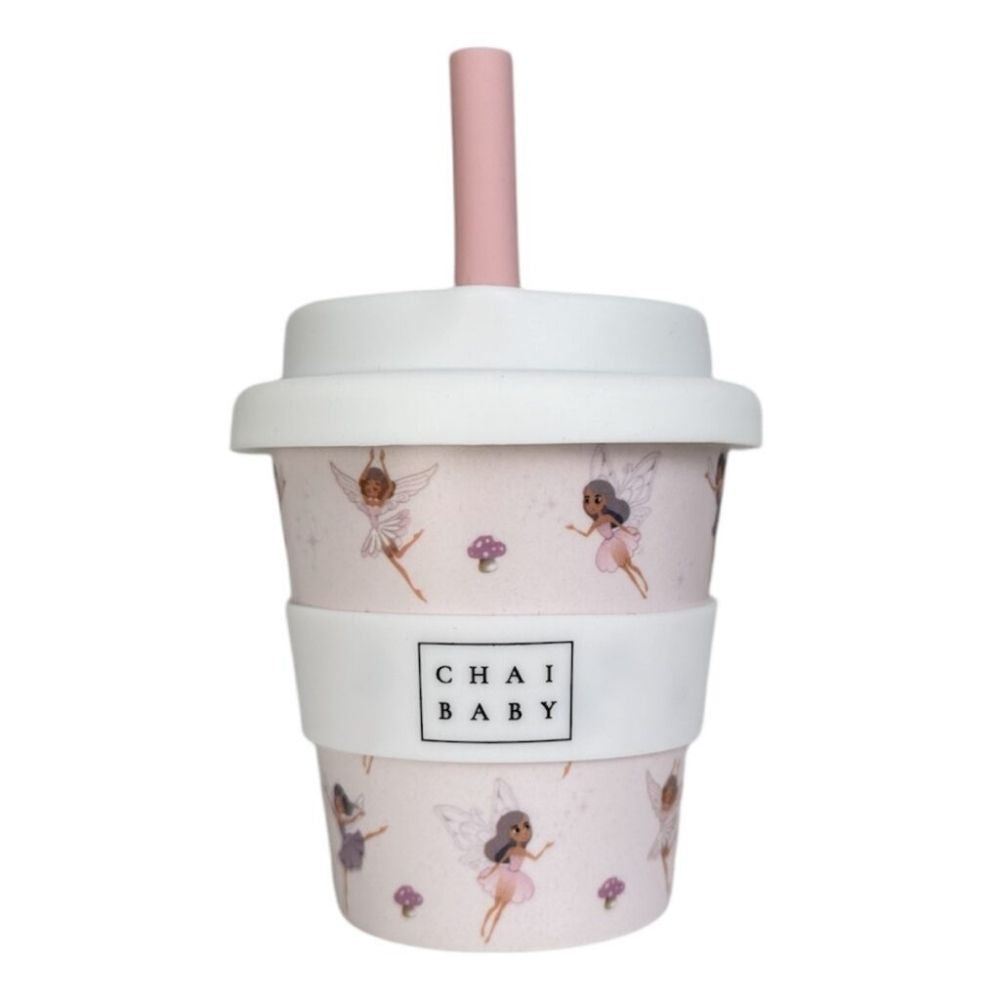 A pink bamboo children's cup with a silicone lid and a red straw, decorated with strawberry patterns and fairies  the brand name 'Chai Baby' displayed on the front.