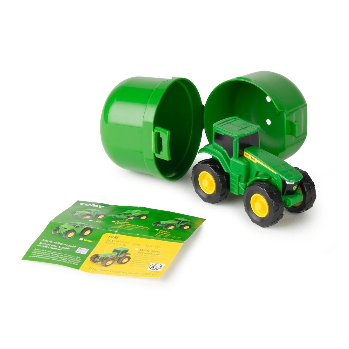 John Deere Toy tractor in a green plastic container with a leaflet on a white background