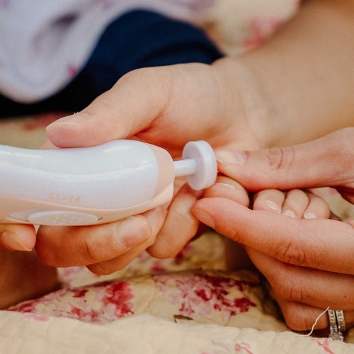 Baby using the nail care kit 